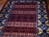 Live in quetta black version ( particolare),  lana annodata a mano su ordito di cotone,  cm.180x270,  2000